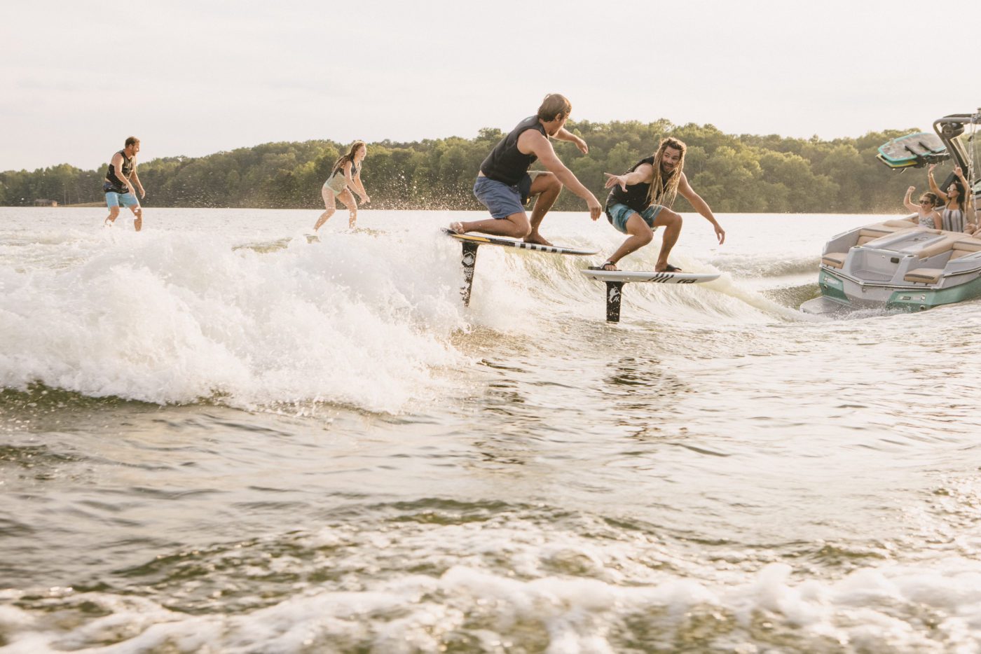 MasterCraft boats creating wakes for surfers