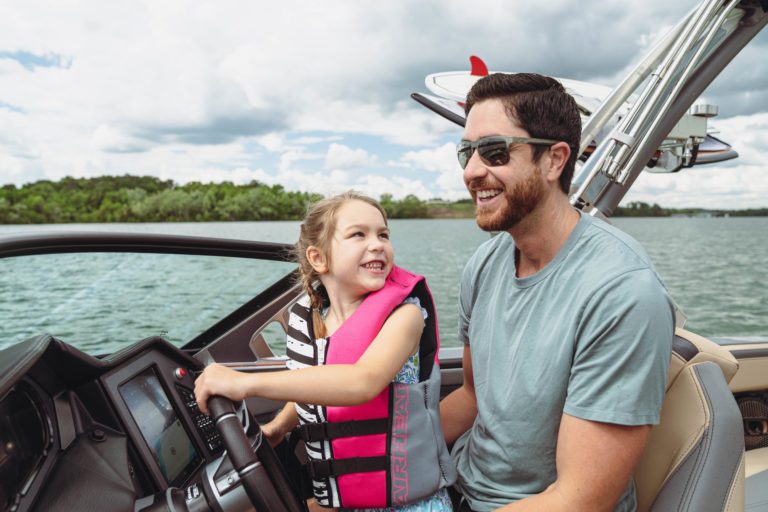 Father and daughter spend quality time on the water.