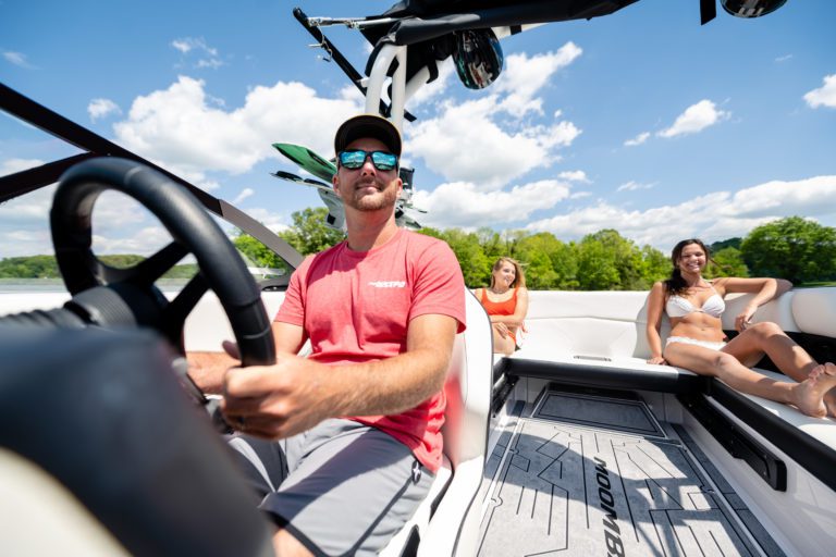 A family enjoy life on the water in a Moomba ski boat.