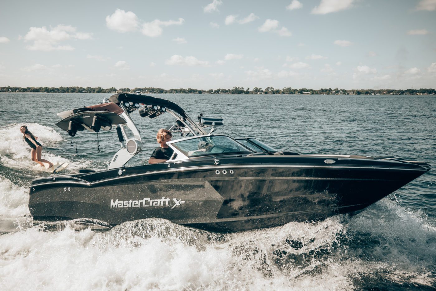 Surfer behind a MasterCraft boat.