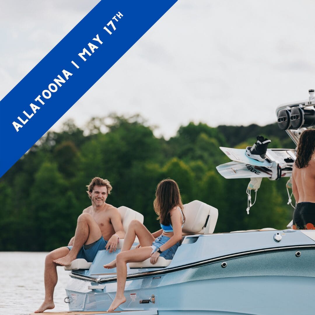 Friends gather around the back of their wake boat