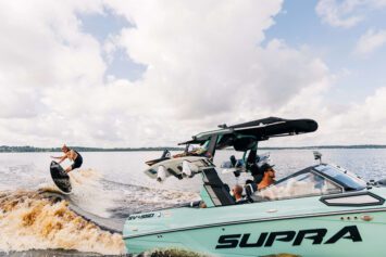 New Supra SV boat with surfer behind him.