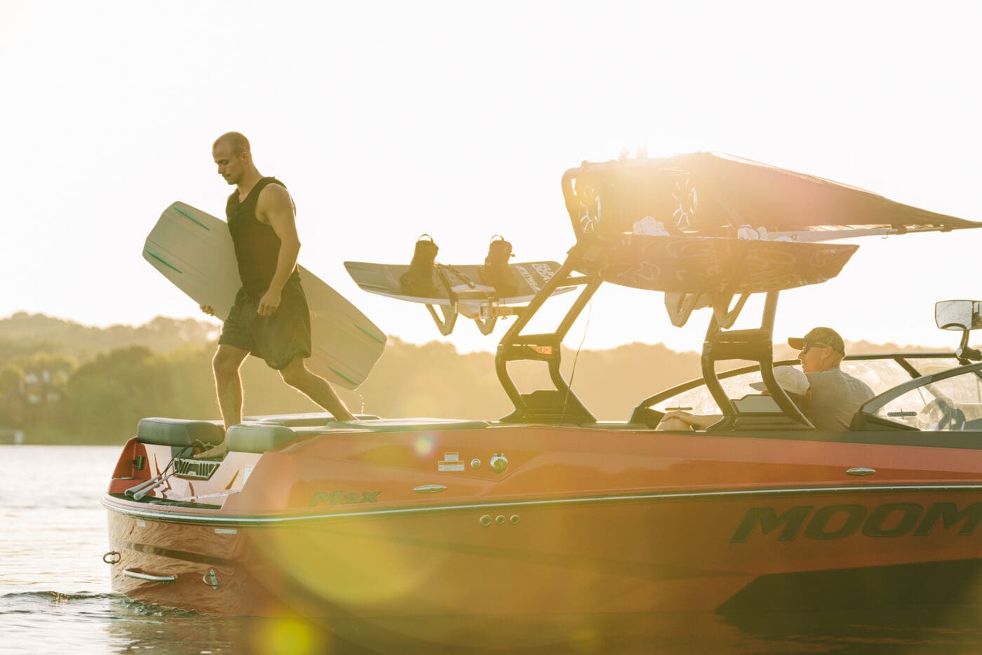 A wakeboarder getting ready to hit the water on a 2025 Moomba Max.