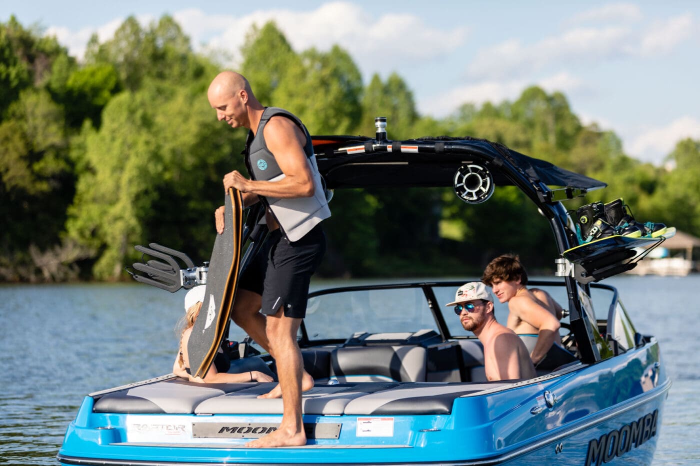 A wakeboarder gets ready to take on wakes behind a Moomba boat.