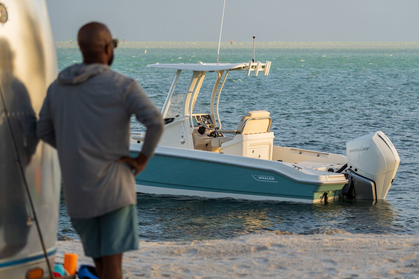 A boaters look out at his Boston Whaler 250- a boat that is sold during the skier's marine experience