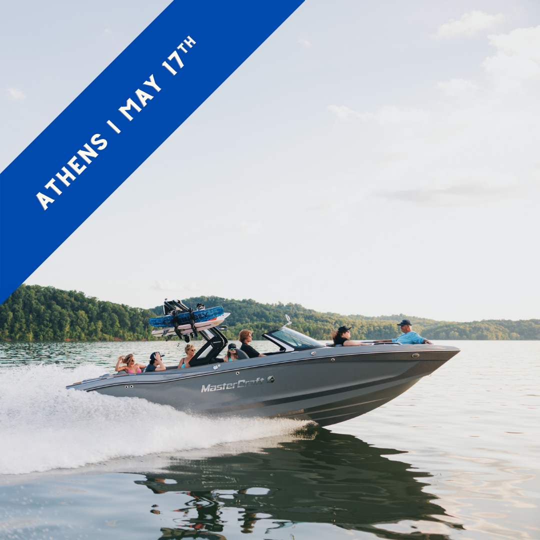 A grey MasterCraft wake boat on the lake.