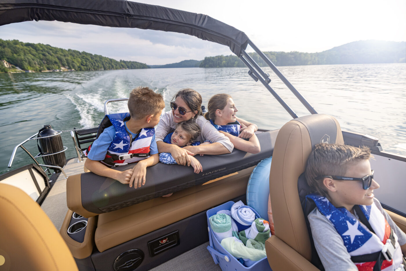 A family rides on the sunbed of the new 2026 Harris Sunliner