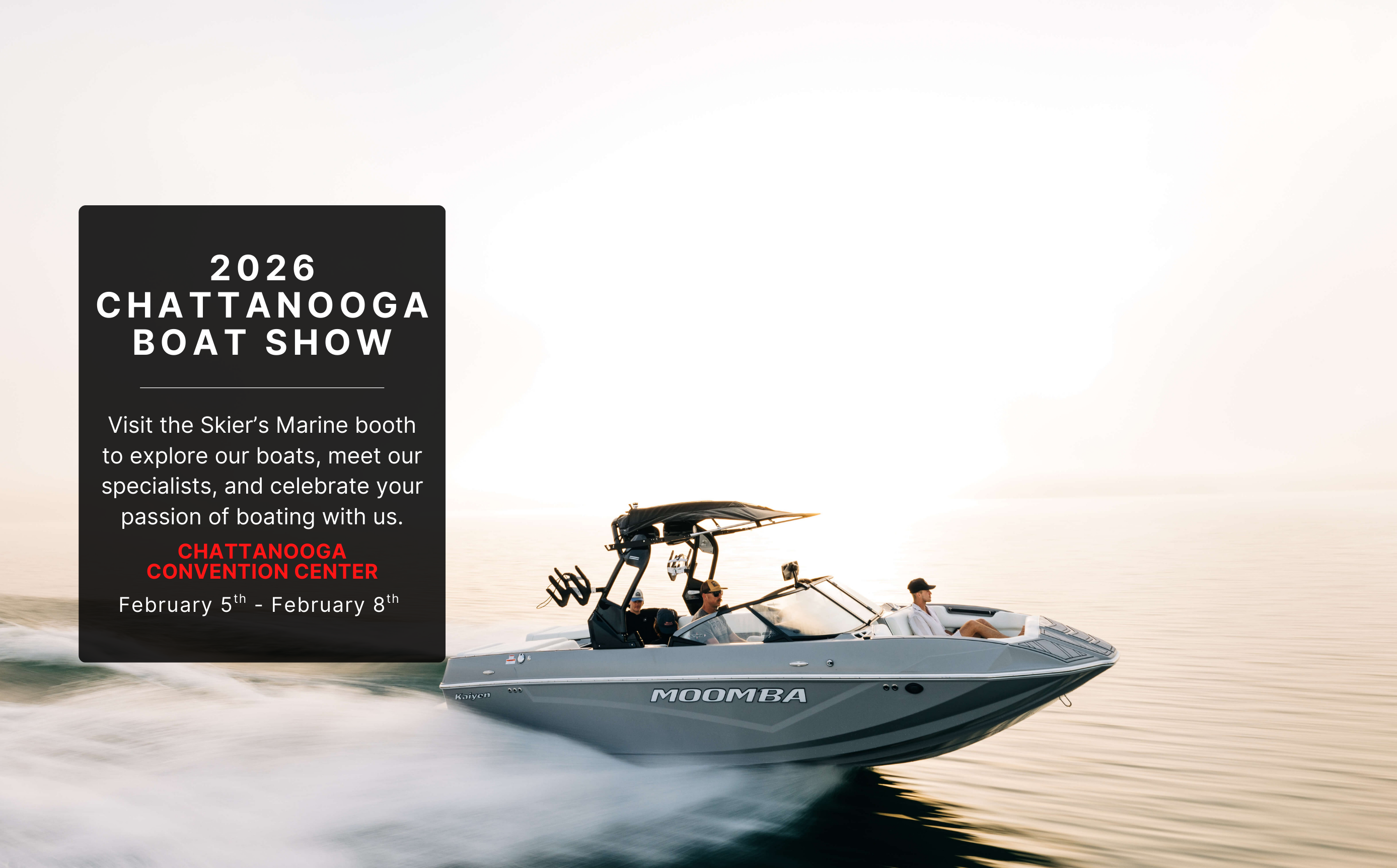 A Moomba wake boat driving across the lake.