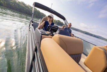 A women at the helm of the 2026 Harris Cruiser